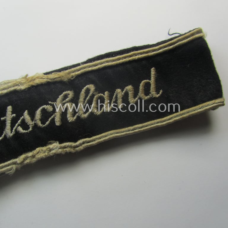 Truly used- and/or worn example of a WH (Heeres) cuff-title ie. armband (ie. 'Ärmelstreifen') entitled: 'Grossdeutschland' (being a neatly machine-embroidered example of the third pattern that was specifically intended for EM- ie. NCO-usage)