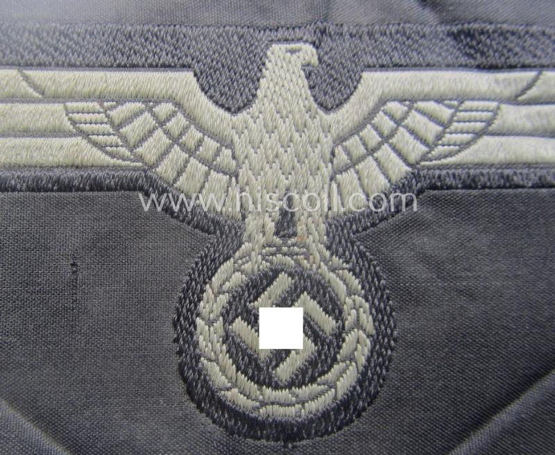 Later- (ie. mid-war-) period, WH (Heeres) 'Panzer'-type breast-eagle (ie. 'Brustadler für Panzertruppen') being a 'virtually mint- ie. unissued' example as executed in bluish-grey-coloured linnen on a black-coloured background