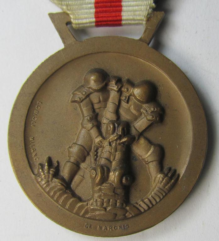Superb, golden-bronze-coloured- (and I deem 'Buntmetall'-based-) example of a: 'Deutsch-Italienische Feldzugsmedaille' (or: German-Italian campaign medal) that comes mounted onto its (regular-sized) piece of original (albeit minimally faded) ribb...
