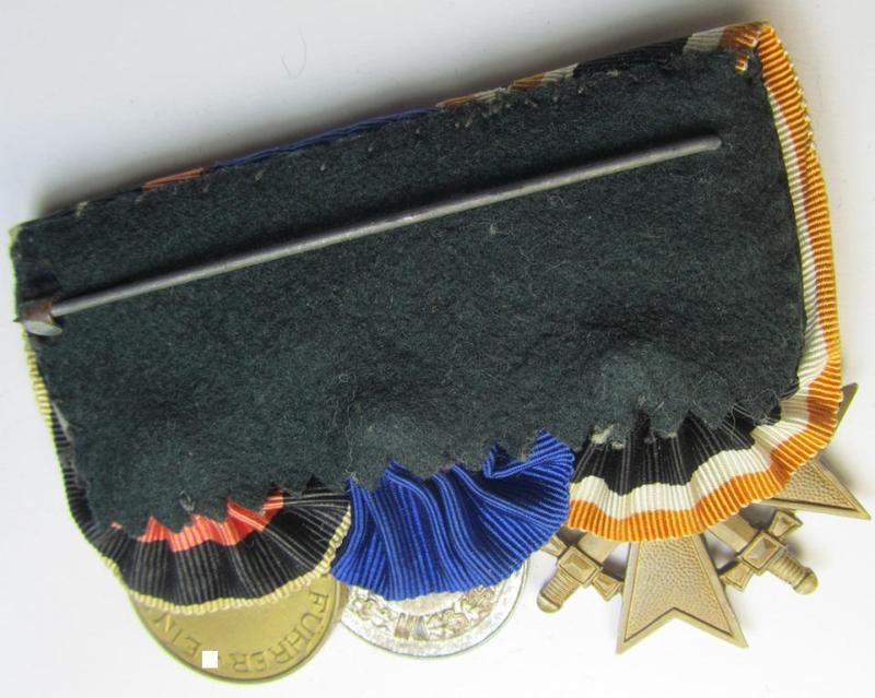 Attractive example of a three-pieced medal-bar (ie.: 'Ordenspange') resp. showing a: 'KvK 2. Klasse mit Schwertern', a: 'WH-DA 4. Stufe' (with firmly attached eagle-device) and a Czech 'Anschluss'-medal '1 Oktober 1938'