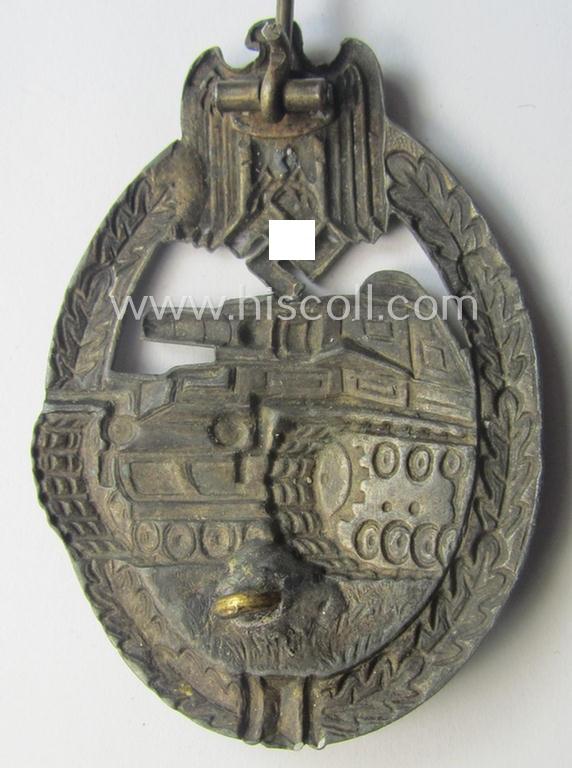 'Panzerkampfabzeichen in Silber' (or: silver-class panzer-assault badge or PAB) being a non-maker-marked- and/or hollow zinc- (ie. 'Feinzink'-) based example as was produced by the: 'Paul Meybauer'-company