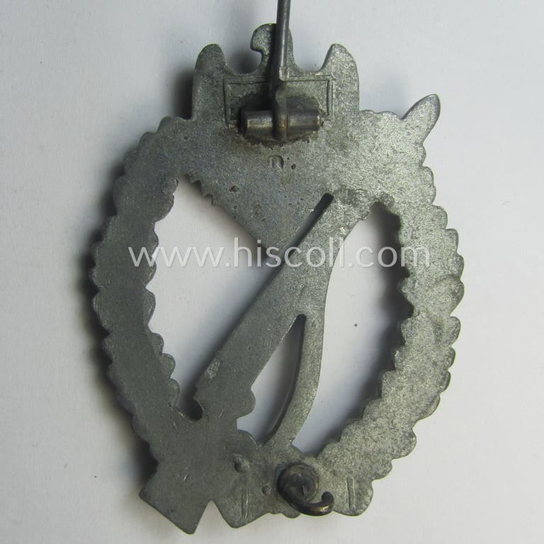 'Infanterie Sturmabzeichen in Silber' being a non-maker-marked and/or typical zinc- (ie. 'Feinzink'-) based version as was (I deem) procuded by the: 'Frank & Reif'-company