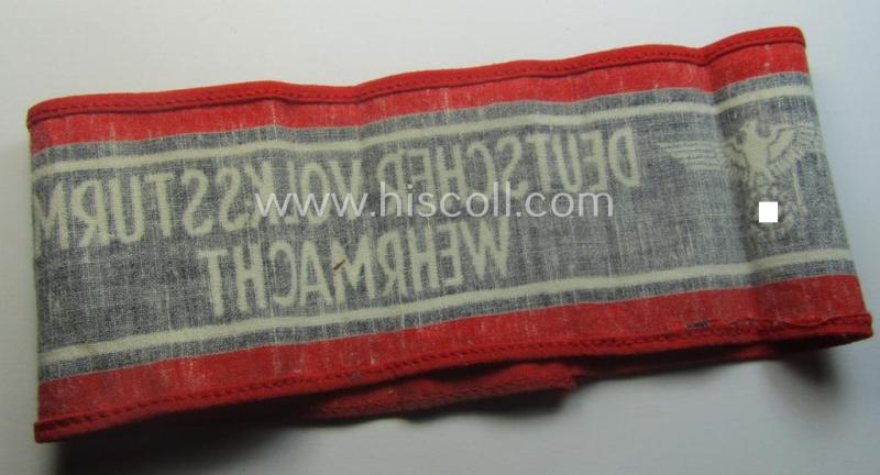 Typically printed- and/or later-war-period, bright-red- and/or black-coloured so-called: 'Deutscher Volkssturm'-armband (ie. 'Armbinde') that comes in an overall very nice- (I deem hardly used- nor worn- ie. 'virtually mint'-), condition