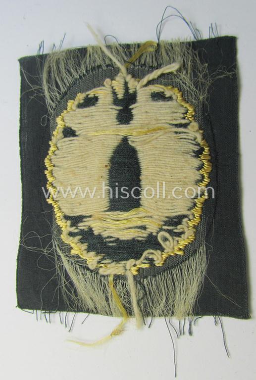 WH (Heeres) 'Richtabzeichen für Artillerie-Richtkannoniere' (or: artillery gun-layers patch) as executed in the neat 'BeVo-weave' pattern (being an unissued- ie. 'virtually mint'- example)