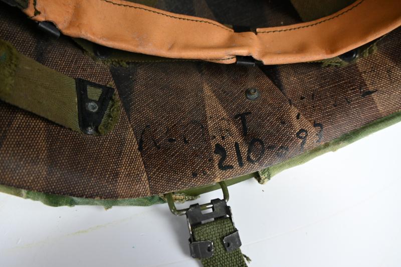 US Vietnam War Infantry helmet with camouflage cover and attached content