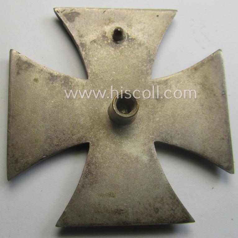 Moderately used, Iron Cross 1st class (or: 'Eisernes Kreuz 1. Klasse') as executed in the scarcely seen so-called: 'screw-back'- (ie. 'An der Schraube'-) pattern being a non-maker-marked example