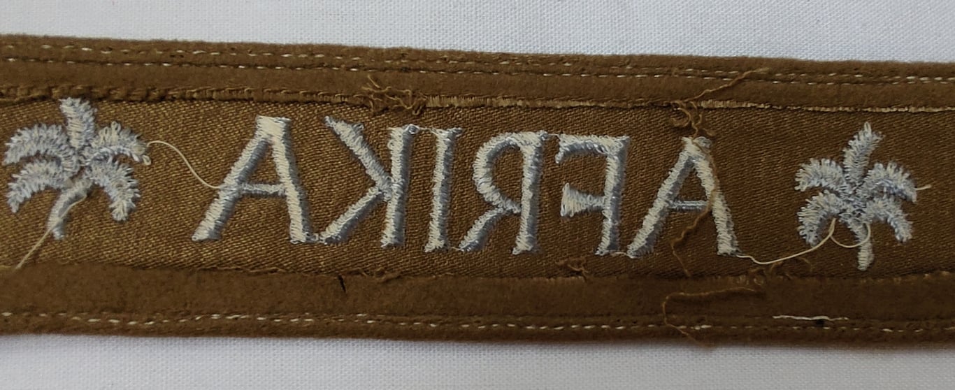 WH cuff-title ('Ärmelstreifen') entitled: 'Afrika'
