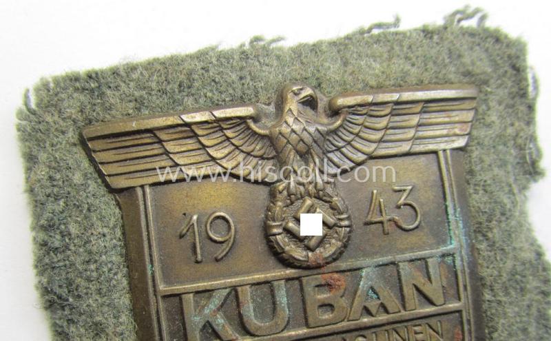 Attractive - just moderatey used and actually scarcely encountered! - WH (Heeres ie. Waffen-SS) 'Kuban'-campaign-shield that comes mounted onto its original field-grey-coloured- and/or woolen-based 'backing'