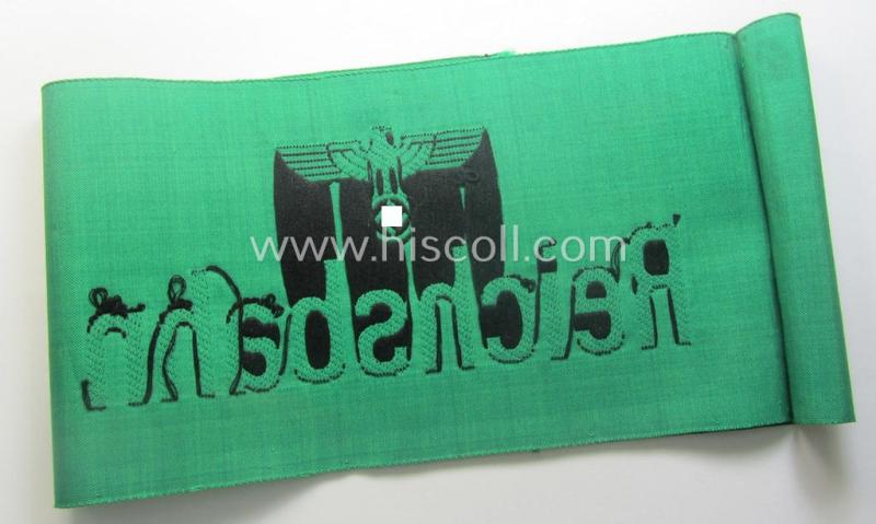 DRB- (ie. 'Deutsche Reichsbahn'-) related armband entitled: 'Reichsbahn' being of the 'entirely-woven'-type onto (typical) silk-like cloth in a technique similar to the 'BeVo'-weave pattern