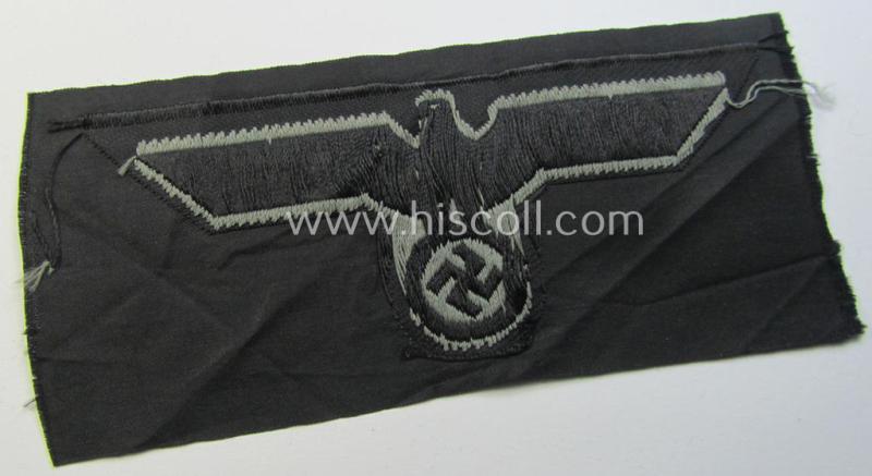 Later- (ie. mid-war-) period, WH (Heeres) 'Panzer'-type breast-eagle (ie. 'Brustadler für Panzertruppen') being a 'virtually mint- ie. unissued' example as executed in bluish-grey-coloured linnen on a black-coloured background
