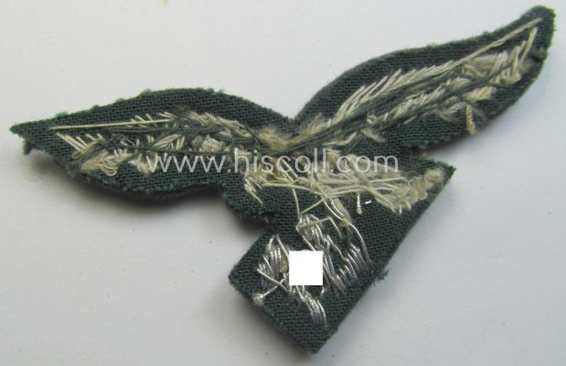 WH (Luftwaffe) officers'-pattern visor-cap-eagle (ie. 'Adler für LW-Offiziers-Schirmmütze') being a neatly hand-embroidered example of the: 'Extra Qualität' that comes in a 'virtually mint ie. unissued'-), condition