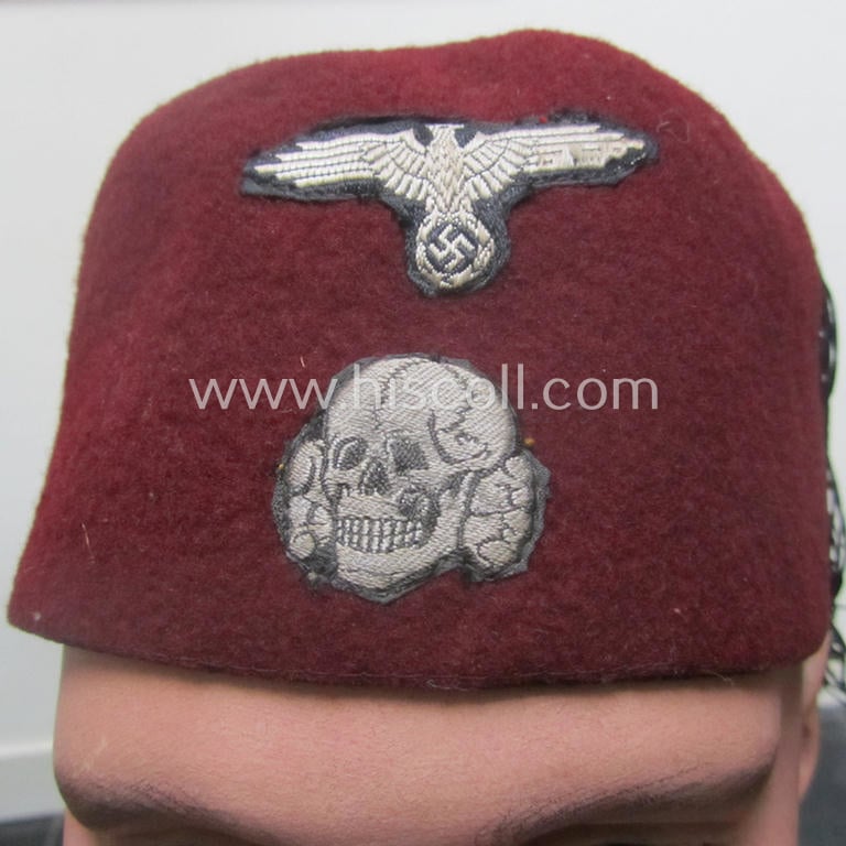Maroon-red-coloured, Waffen-SS-pattern so-called: 'Fez' having a neat - and fully matching! - silver-grey-coloured- and/or 'BeVo'-woven insignia-set originally- (ie. 'off-factory'-) attached