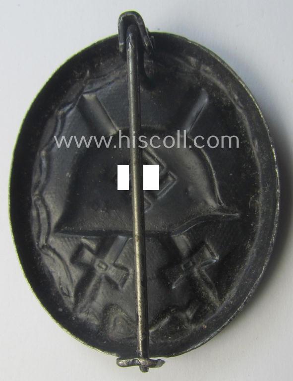 Maker- (ie. '63'-) marked example of a black-class wound-badge (or: 'Verwundeten-Abzeichen in Schwarz') being an example that was produced by the maker (ie. 'Hersteller') named: 'F.J. Klast & Söhne'