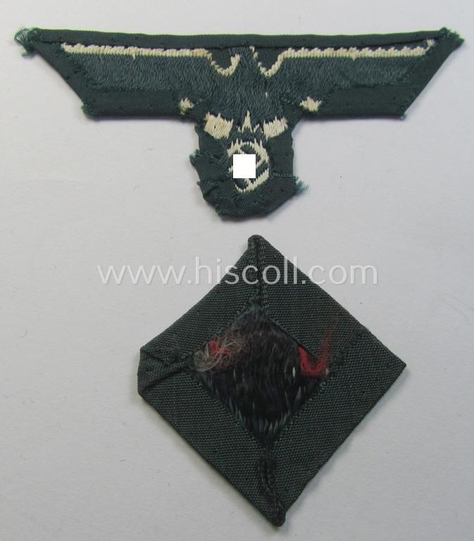 Pre- (ie. early-) war-period, WH (Heeres) cap-eagle & cocarde-set (ie. 'Schiffchenmützen-Adler u. Kokarde für Mannschaften u. Uffz.') being a cap-removed set as executed in bluish-grey-coloured linnen on a darker-green-coloured background