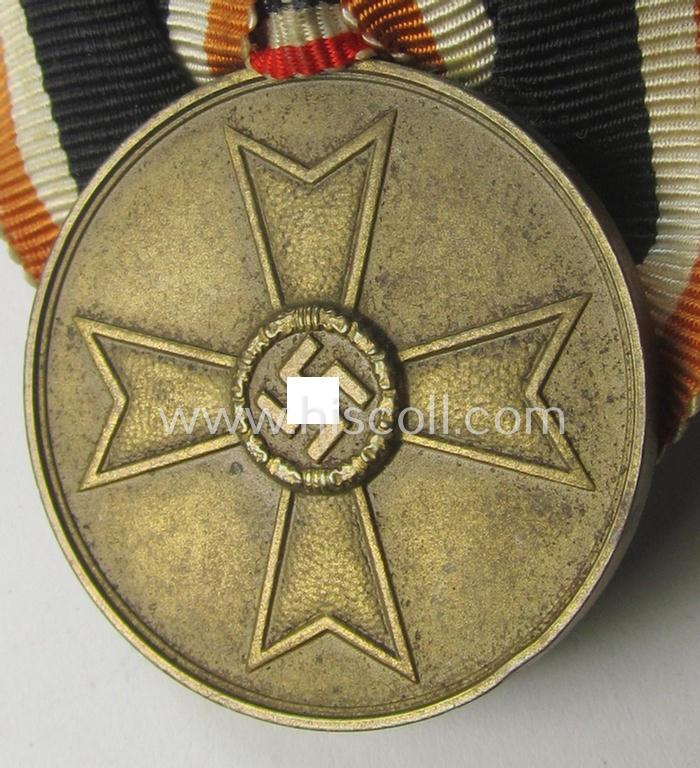 Attractive - and truly rarely found! - example of a so-called: 'Einzelspange' (ie. single-pieced medal-bar) showing a: 'Kriegsverdienstmedaille 1939' (or: war-merits-medal), being a neat 'Buntmetall'-based specimen