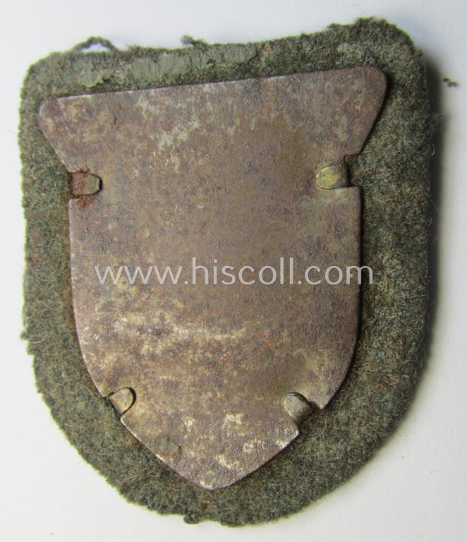 Very attractive - and actually scarcely encountered! - WH (Heeres ie. Waffen-SS) 'Kuban'-campaign-shield that comes mounted onto its original field-grey-coloured- and/or woolen-based 'backing' as issued and/or used