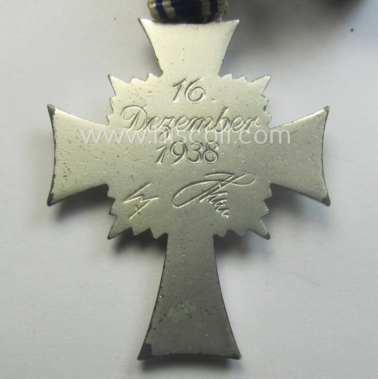 'Ehrenkreuz der deutschen Mutter - zweite Stufe' (or: silver-class mothers'-cross) that came mounted onto its long-sized ribbon and that came stored in its period pouch by the maker: 'Moriz Hausch A.-G. - Pforzheim'