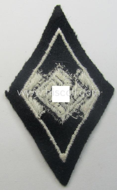 Waffen-SS-pattern, machine-embroidered and/or black- and white-coloured sleeve-insignia (ie. 'Ärmelraute') depicting a so-called: 'HJ-Raute' as was used and intended to signify former membership within the 'Hitlerjugend'