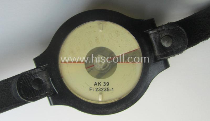 Attractive - and/or fully functional! - example of a WH (Luftwaffe) black-coloured- and/or resin-based, pilots'-armband-compass of the type: 'AK 39' that comes mounted onto its period, bluish-black-coloured strap as issued and/or used