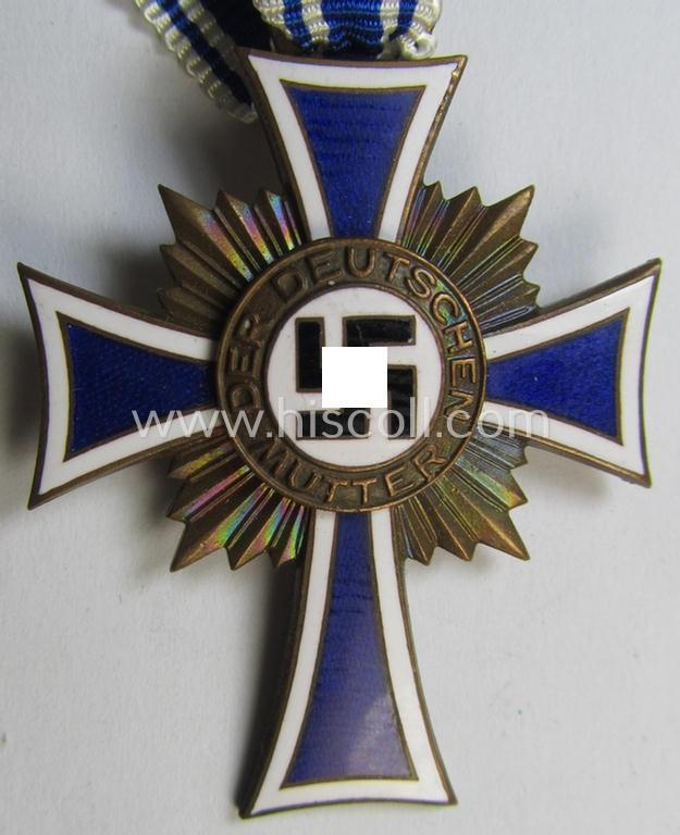 'Ehrenkreuz der Deutschen Mutter - Dritte Stufe' that comes in a 'virtually mint- ie. unissued', condition