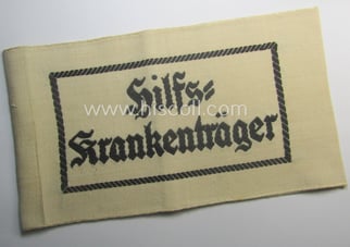 Beige-white-coloured- and/or linnen-based armband (ie. 'Armbinde') as was...
