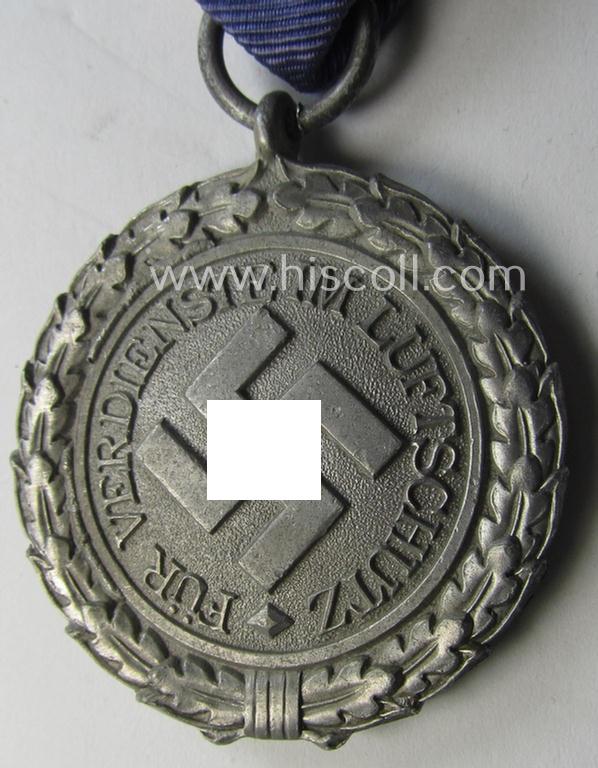 Neat, 'Luftschutz-Ehrenzeichen 2. Stufe' being a non-maker-marked example as executed in (light-weight) aluminium-based metal and that comes mounted onto its period (confectioned) ribbon ie. 'Bandabschnitt'