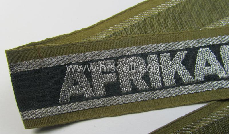 Superb, 'BeVo'-like cuff-title (ie. 'Ärmelstreifen') entitled: 'Afrikakorps' being a presumably issued but simply never worn example that comes in an overall very nice- (ie. non-shortened- and never tunic-attached-), condition