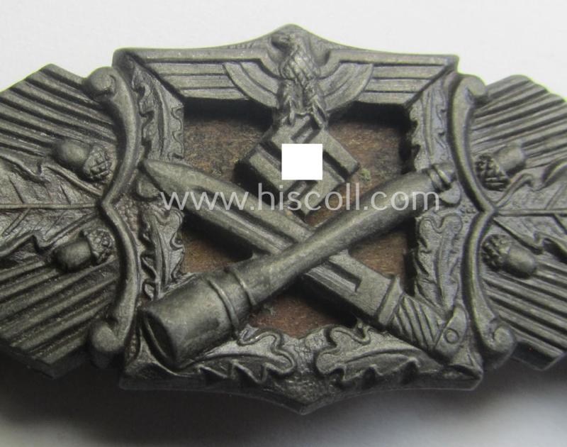 'Nahkampfspange in Bronze' (or: bronze-class close-combat clasp ie. CCC) being a neatly maker-marked- and/or minimally converse-shaped specimen as was produced by the: 'JFS'- (ie. 'Joseph Feix u. Söhne'-) company