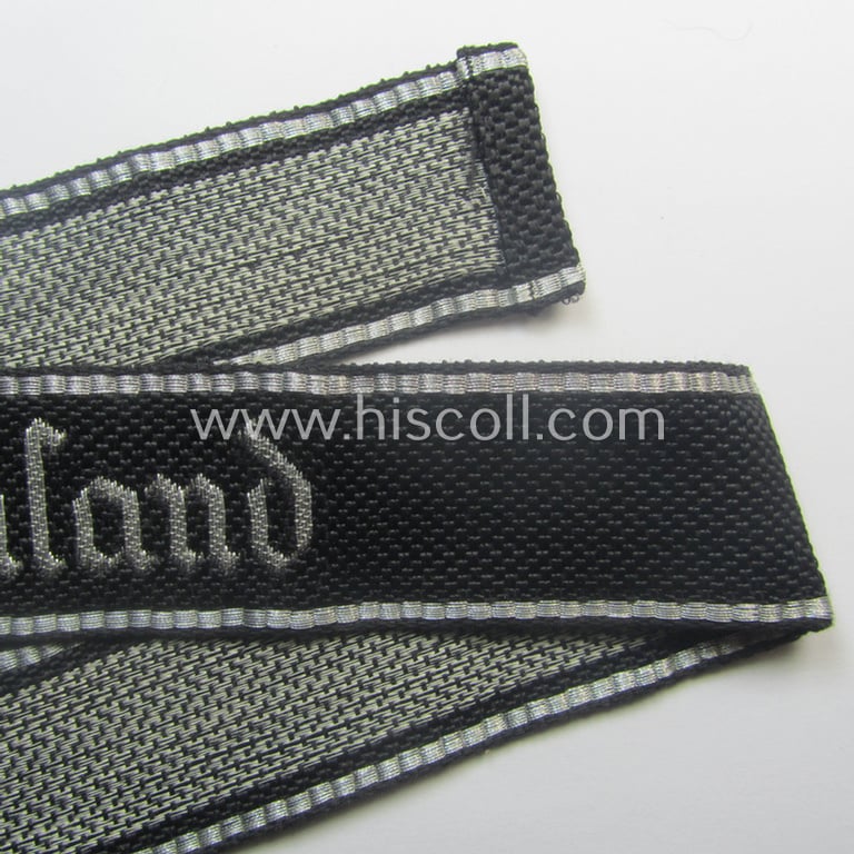 Stunning, Waffen-SS officers'-type, 1939/40-pattern cuff-title (ie. 'Ärmelstreifen') as executed in flat-wire 'BeVo'-weave-pattern (in Gothic-styled script!) for an officer within the: SS-Rgt. 'Deutschland' (2. SS-Pz-Div. "Das Reich")