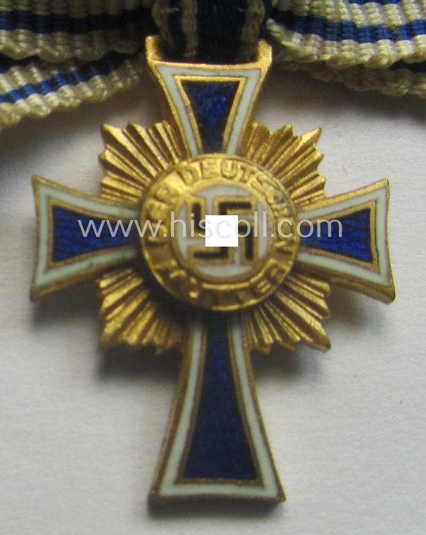 Miniature of an: 'Ehrenkreuz der deutschen Mutter - erste Stufe' (or: golden-class mothers'-cross) being a non-maker-marked example that comes in an overall nice- (albeit moderately worn- ie. used-), condition