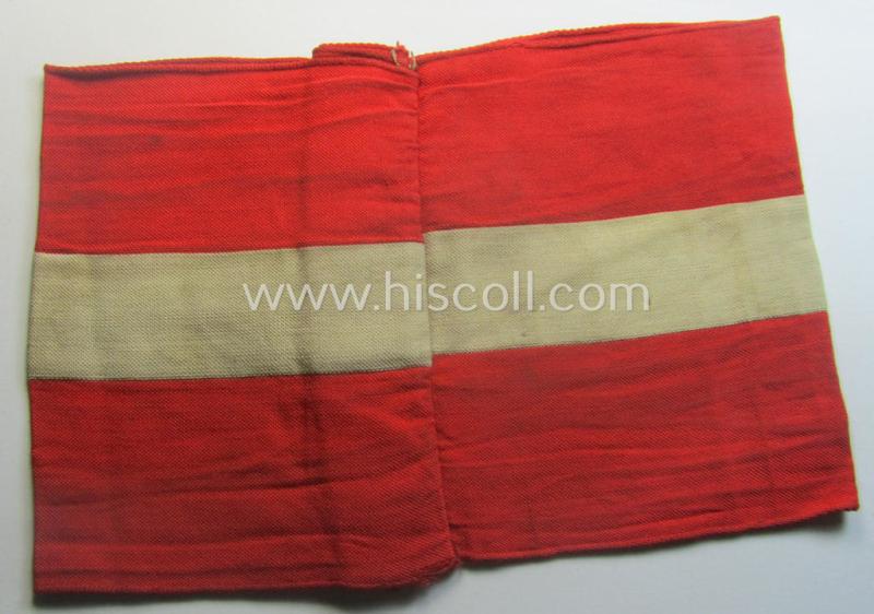 'Standard-issued'-pattern (ie. entirely woven) pattern, bright-red-coloured HJ- (ie. 'Hitlerjugend'-) related armband (ie. 'Armbinde') being a moderately worn- ie. used example that misses its 'RzM'-etiket