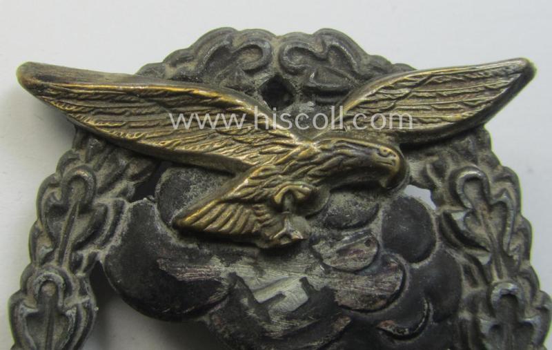 Relic- (ie. denazified), mid- (ie. later-) war-period, zinc- (ie. 'Feinzink'-) based version of a WH (Luftwaffe) 'Erdkampfabzeichen' as was produced by the: 'J.E. Hammer u. Söhne'-company