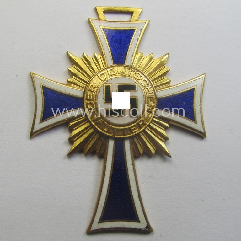 'Ehrenkreuz der deutschen Mutter - erste Stufe' (or: golden-class mothers'-cross) being a 'virtually mint' example that comes with its accompanying, long-sized- (and also 'mint'!) ribbon as issued and/or recently found