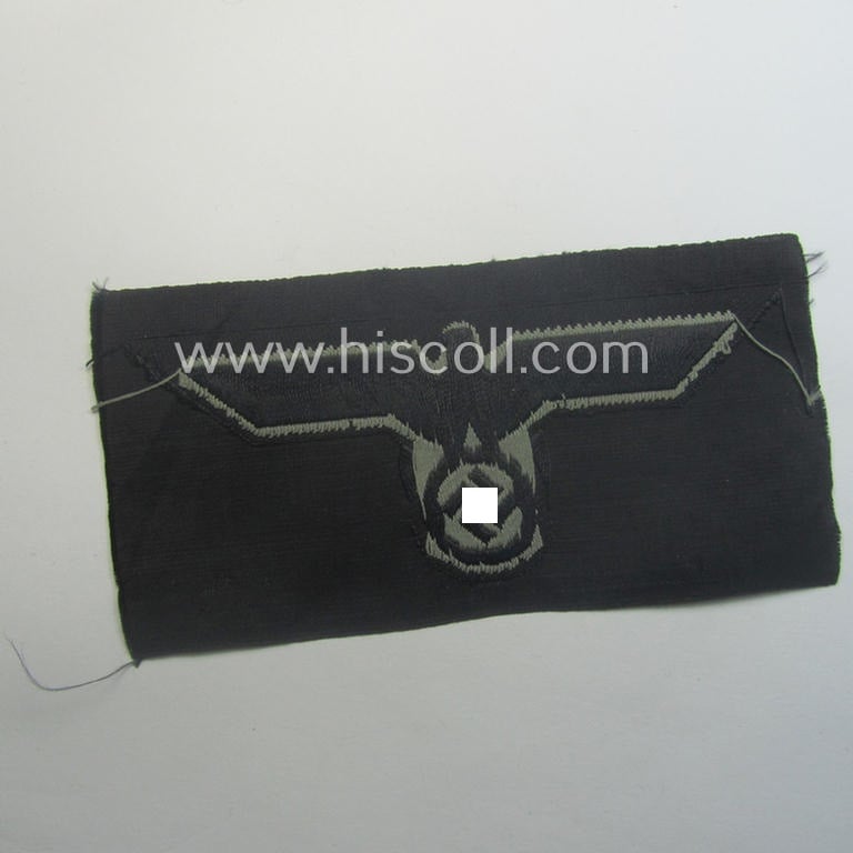 Later- (ie. mid-war-) period, WH (Heeres) 'Panzer'-type breast-eagle (ie. 'Brustadler für Panzertruppen') being a 'virtually mint- ie. unissued' example as executed in bluish-grey-coloured linnen on a black-coloured background