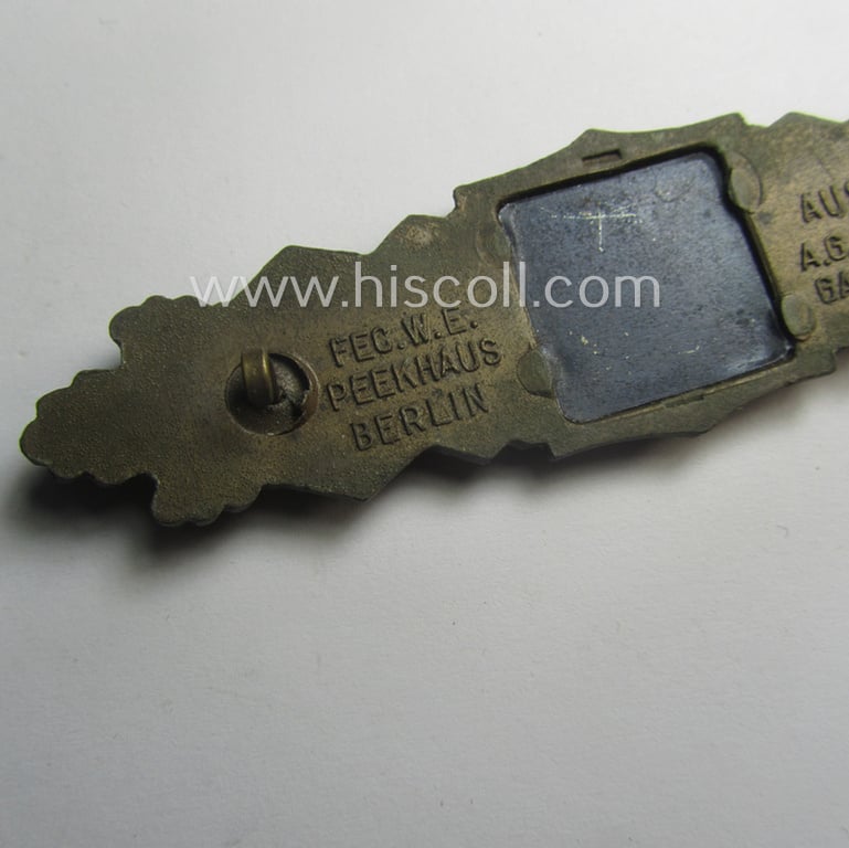 Superb, 'Nahkampfspange in Bronze' (or: bronze-class close-combat clasp ie. CCC) being a maker- (ie. 'A.G.M.u.K.'-) marked- and/or minimal converse-shaped specimen having its period-attached (black-toned and steel-based) 'back-plate' in place