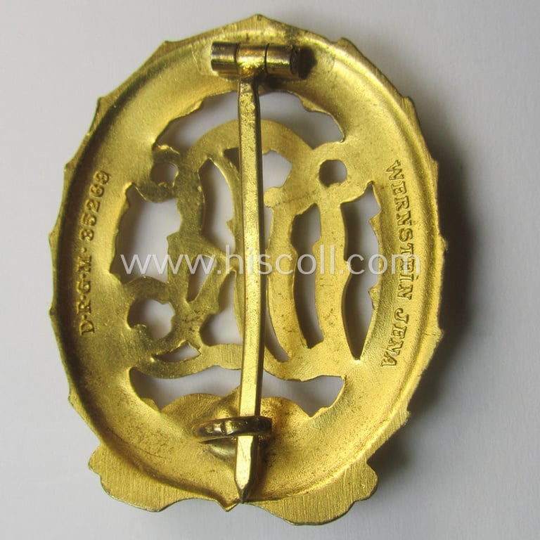 Minimally used - and truly rarely found! - example of a: 'Reichssportabzeichen DRL in Gold' (or: DRL sports'-badge in gold) being a just moderately worn- ie. used example that is nicely maker- (ie. 'Wernstein - Jena'-) marked on its back