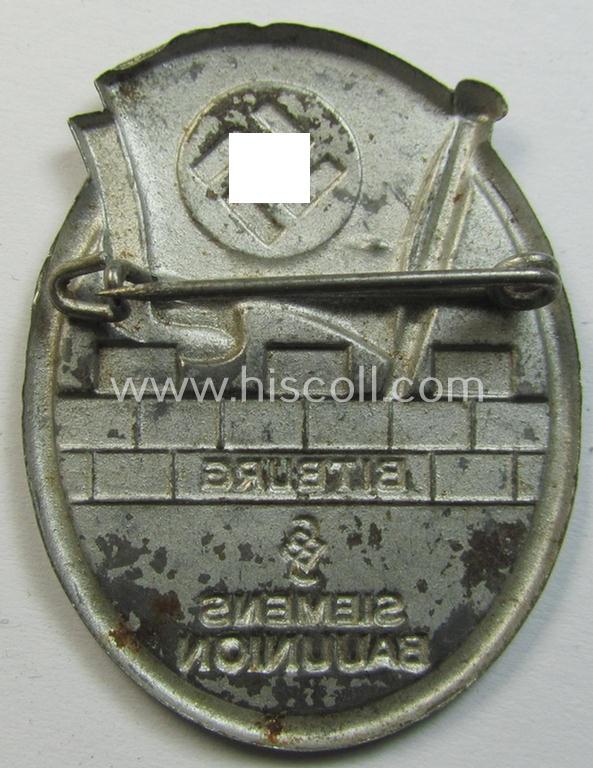 Attractive - and unusually found! - N.S.D.A.P.-related 'tinnie' (ie. 'Tagungs- o. Veranstaltungsabzeichen') that is showing a flying swastika-flag and text that simply reads: 'Siemens Bauunion - Bitburg'