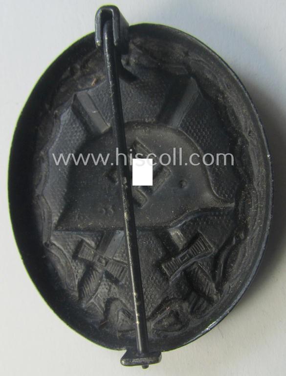 Maker- (ie. '63'-) marked example of a black-class wound-badge (or: 'Verwundeten-Abzeichen in Schwarz') being an example that was produced by the maker (ie. 'Hersteller') named: 'F.J. Klast & Söhne'