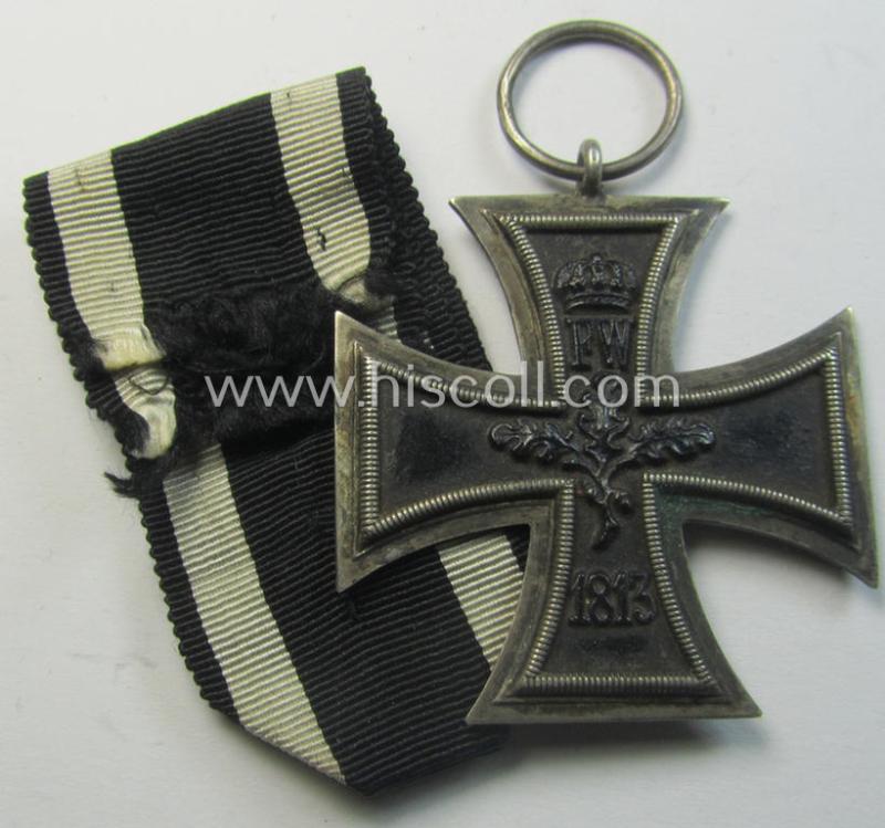 Attractive, WWI-period: 'Eisernes Kreuz II. Klasse' (or: iron cross second class) being a maker- (ie. 'KO'-) marked example that comes together with its (minimally) confectioned piece of ribbon (ie. 'Bandabschnitt')