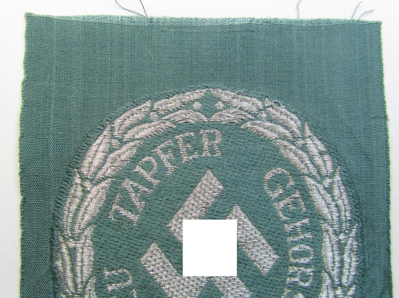Superb - and actually rarely encountered! - officers'- (ie. evt. NCO-) type, so-called: 'Schutzmannschaften'- (ie. 'Schuma'-) armshield being executed in silver-grey-coloured 'flatwire'-thread onto a police-green-coloured background