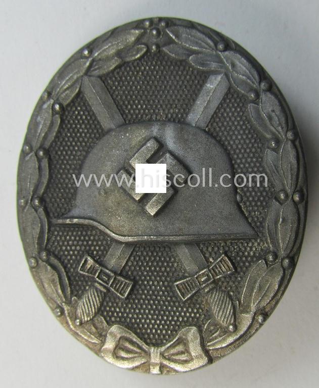 Attractive - and moderately used- and worn! - example of a maker- (ie. '65'-) marked example of a silver-class wound-badge (or: 'Verwundeten-Abzeichen in Silber') as was produced by the 'Hersteller' ie. maker: 'Klein u. Quenzer'