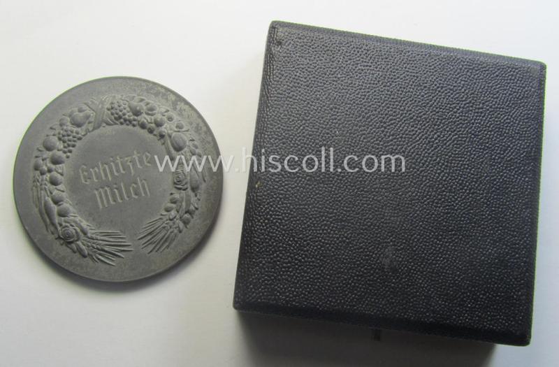 Greyish-silver-toned, 'Reichsnährstand'- (ie. 'RNSt.'-) related, commemorative-award-plaque entitled: 'Reichsnährstands-Austellung - Blut und Boden - Leipzig 1939 - erhitzte Milch' and that comes stored in its period etui
