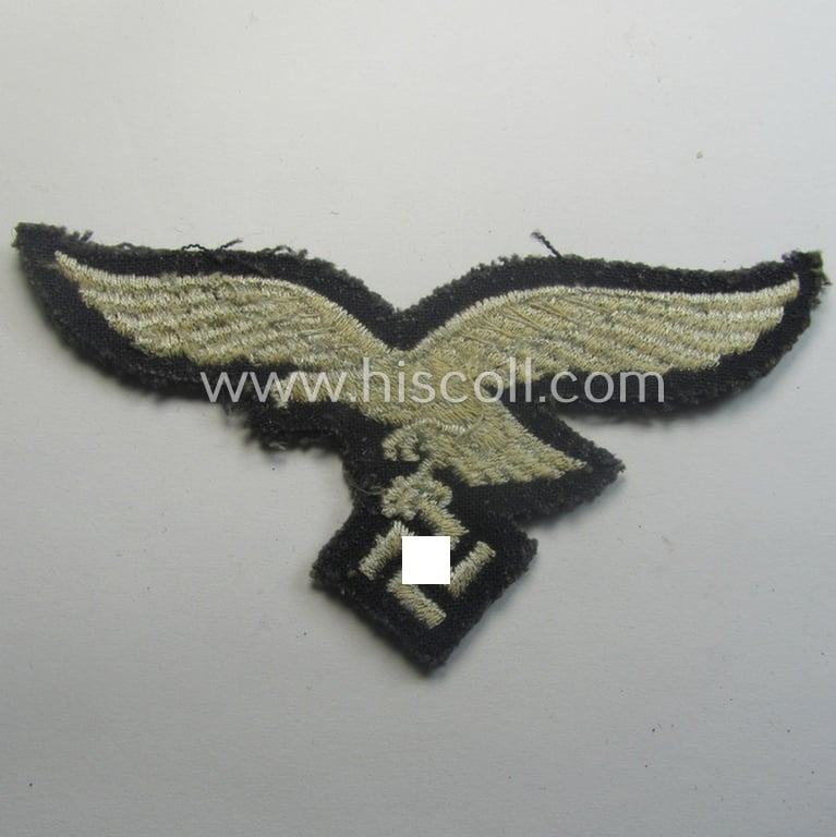 'Cut-off of a tunic' - WH (Luftwaffe) EM- (ie. NCO-) type breasteagle (ie. 'Brustadler für Mannschaften und Unteroffiziere der Luftwaffe')