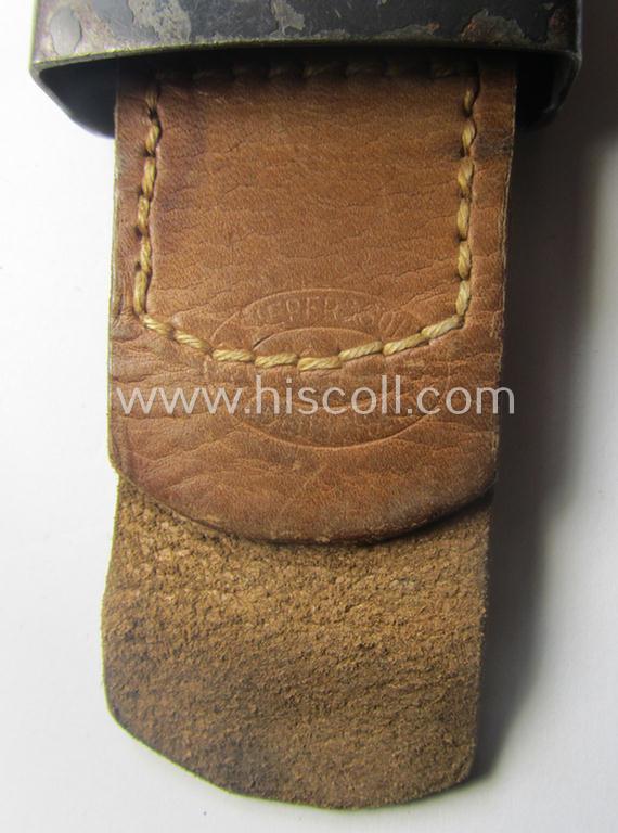 WH (Luftwaffe) bluish-grey-coloured, steel-based belt-buckle being a maker- (ie. 'R. Sieper & Söhne'-) marked example that comes mounted onto its leather-based tab