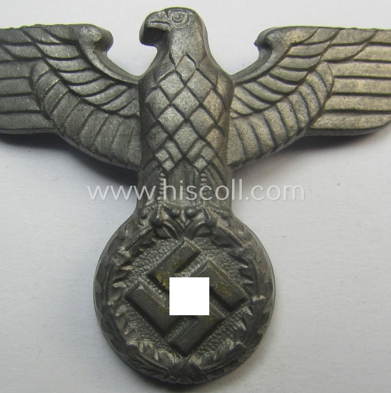 Silverish-golden-coloured- and/or: zinc- (ie. 'Feinzink'-) based (political-style) visor- (ie. 'Schirmmützen'-) cap-eagle being a detailed example that is void of a makers'-designation