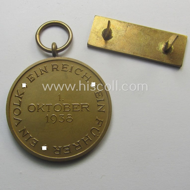 WH Czech-occupation- (ie. 'Anschluss'-) medal: '1. Oktober 1938' that comes with its accompaning 'PB-Spange' and that comes stored in its period pouch by the maker: 'Eugen Schmidhäussler - Pforzheim'