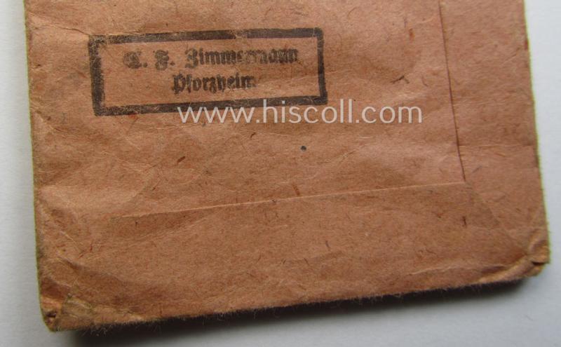 Empty 'Zellstoff'-based pouch as was intended for a medal: 'Winterschlacht im Osten 1941/42' as was produced by the: 'C.F. Zimmermann'-company (ie. 'Hersteller 20')