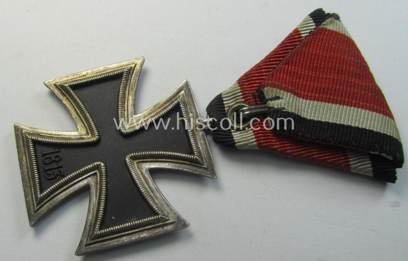Neat, Iron Cross 2nd class (or: 'EK II. Klasse') being a non-maker-marked example that comes mounted onto its original (Austrian-styled!) ribbon (ie. 'Bandabschnitt') as was (I deem) produced by the (Austrian-based) company named: 'Rudolf Souval...