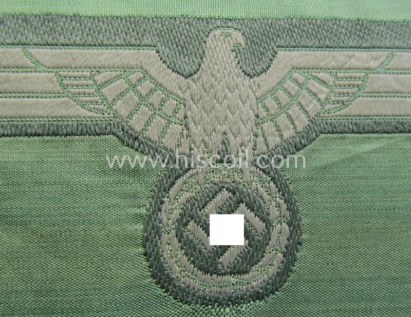 WH (Heeres) mid-war-period- and/or greyish-coloured breast-eagle of the so-called: 'M41'- (ie. 'M43'-) pattern 'Brustadler für Mannschaften u. Unteroffiziere') as executed in the neat 'BeVo'-weave pattern on a field-grey-coloured background