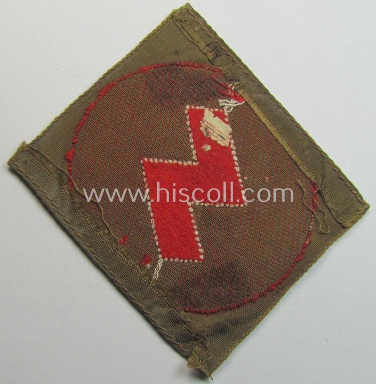 Truly used, DJ (ie. 'Deutsches Jungvolk') arm-badge as was specifically intended for usage by a member who served within the: 'Oberbann 1' (being a tunic-removed example that is void of an 'RzM'-etiket)